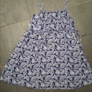Pattered mini dress with tie up sides.